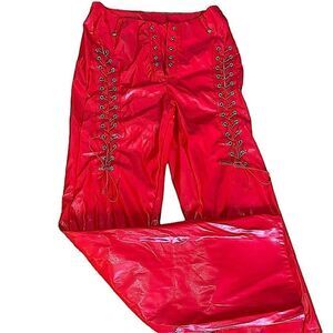 Red stretch pleather lace up pant. Cut out 4 skin size large front lace missing